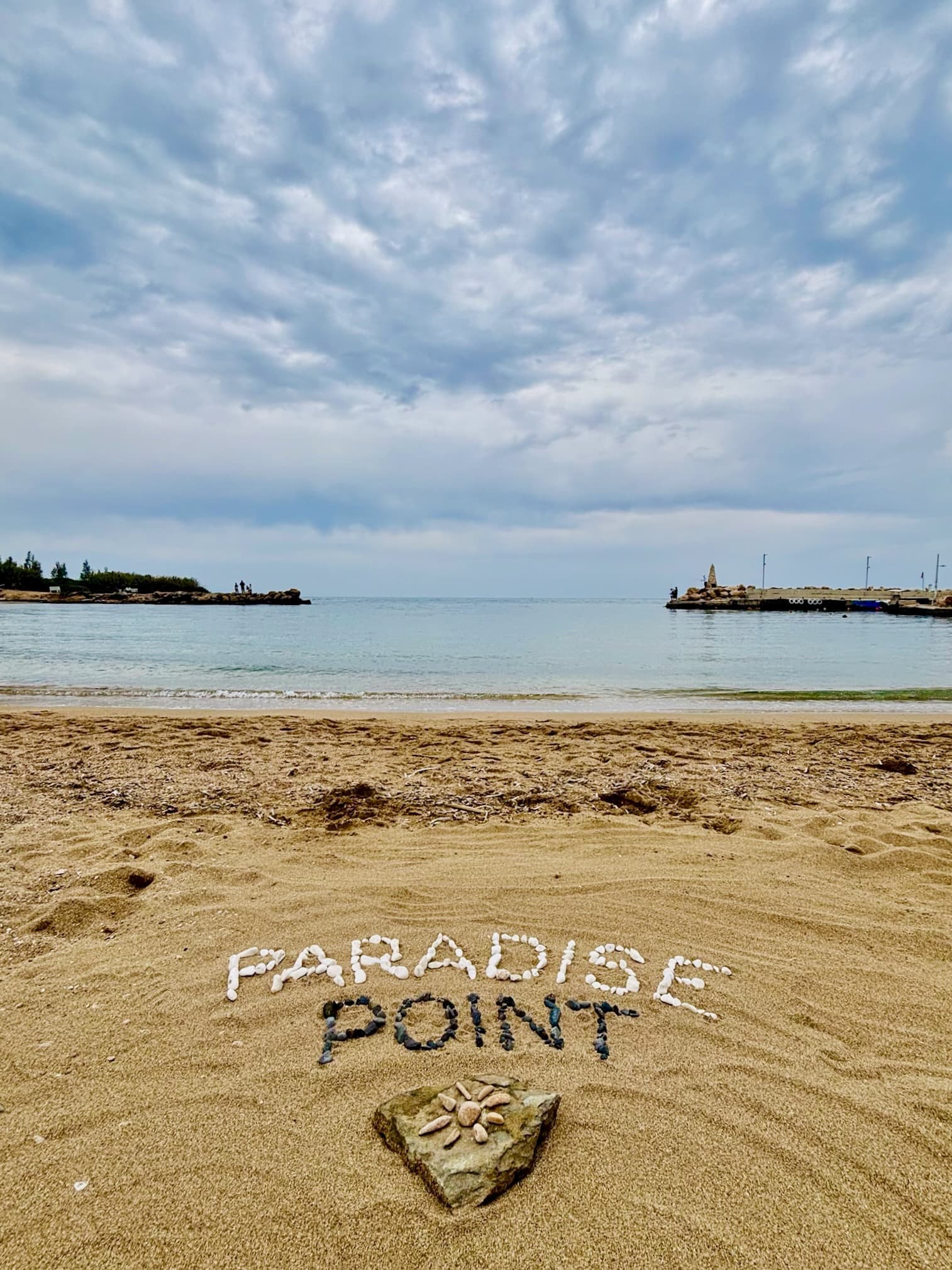 Paradise Point written in stones on the nearby beach