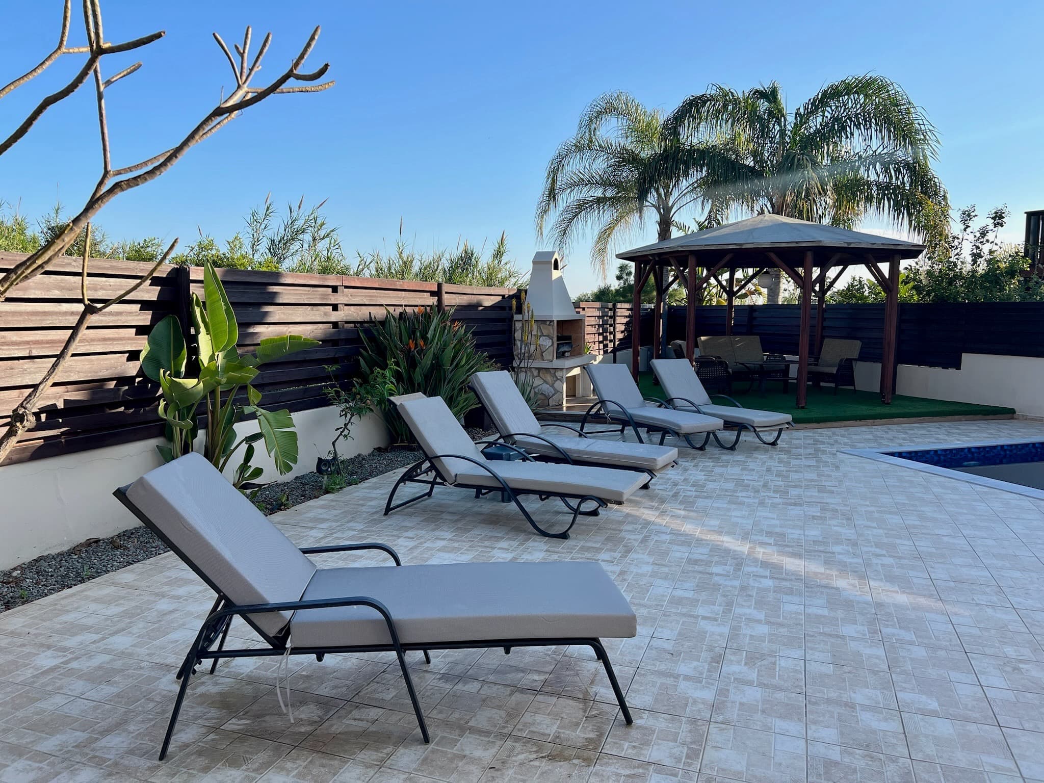 Sun loungers beside the private pool